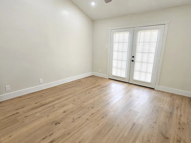 Master Bedroom with balcony overlooking Fenced in back yard