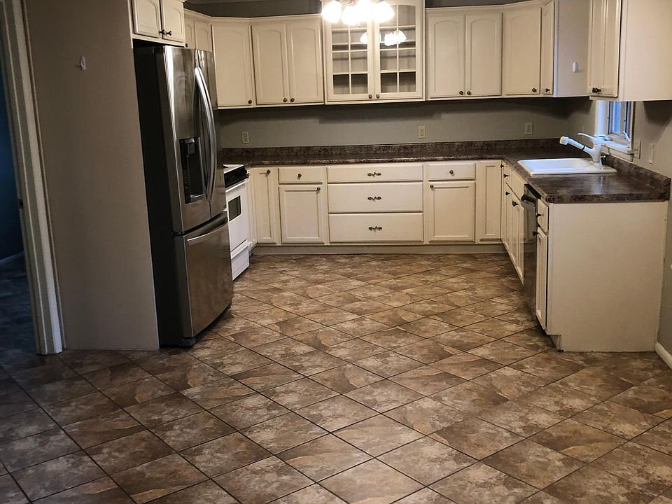 Kitchen showing area for dining table area
