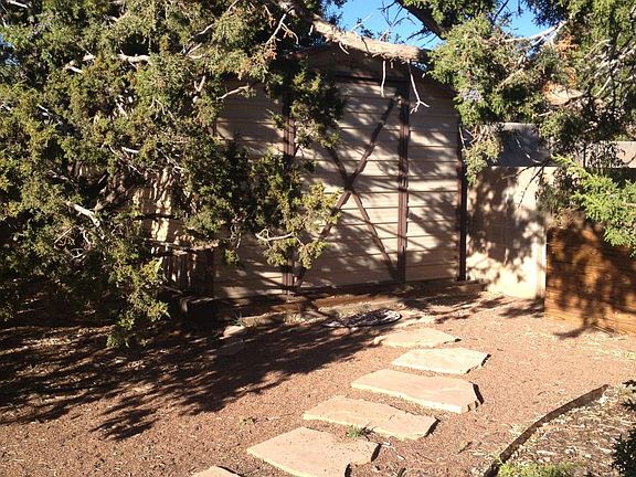 Storage Shed Tucked Away In Back Yard