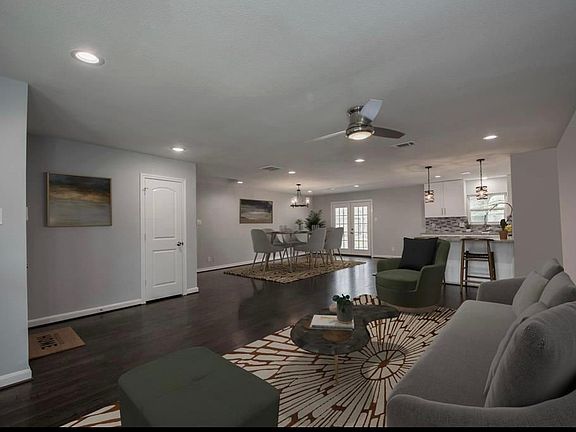 envision yourself in this living room and dining room