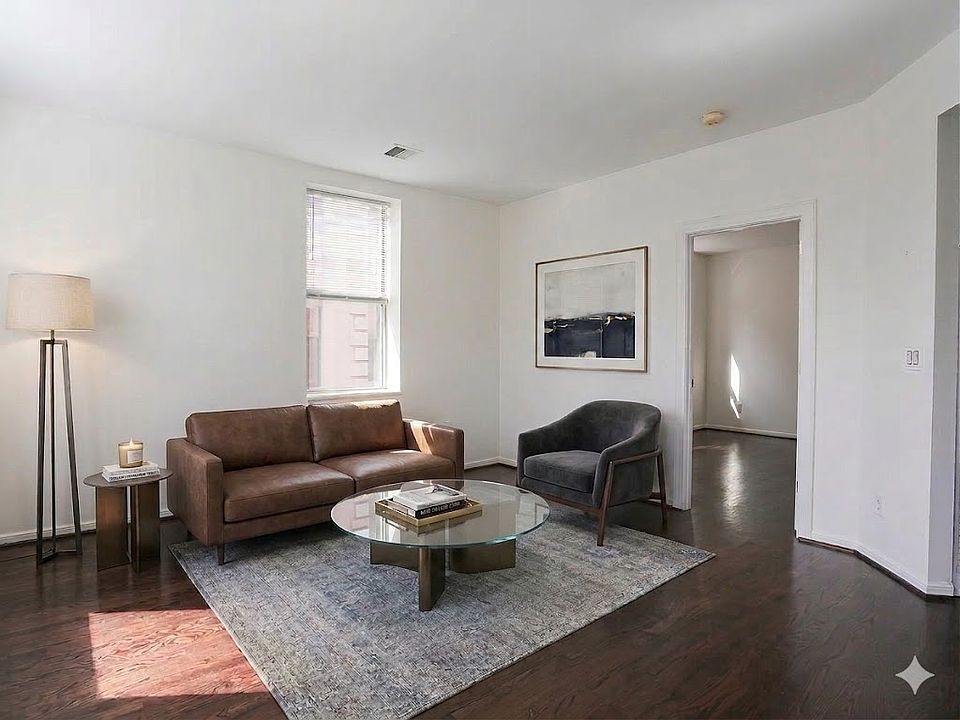 Sun-Filled Living Room with Dark Wood Flooring