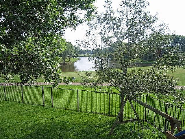 Beautiful view of the lake and golf course from all backyard windows