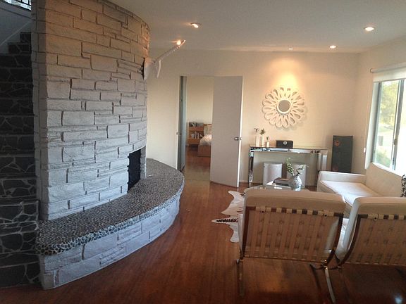 second living space with fireplace. Can be used as office, movie room, or playroom