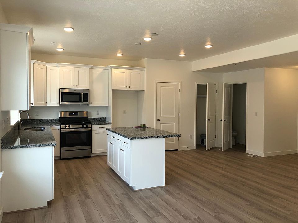Main level. Kitchen with beautiful granite countertops and stainless steel GE appliances. Picture shows Pantry, storage closet and powder room.