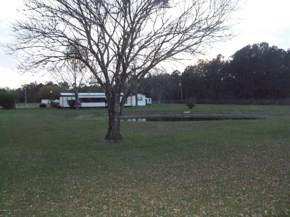 View across pond from road