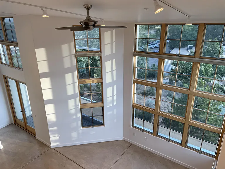 Upstairs space in 3202 "The Edward" Loft has full views of the gigantic windows.