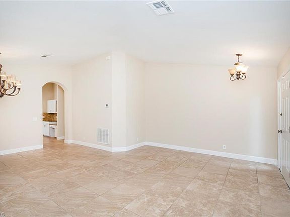 Formal/Front Living Areas to Entrance Door and Archway to Kitchen
