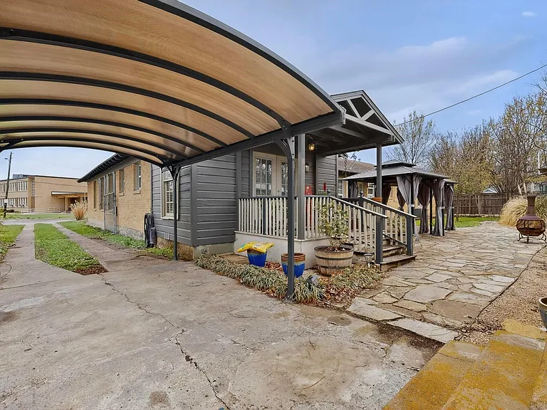 Entrance to Unit 1707 with a carport at the side and a gazebo at the back
