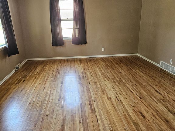 Living Room with refinished hardwood flooring.