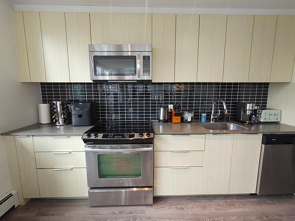 Kitchen. Large and small appliances pictured are included.