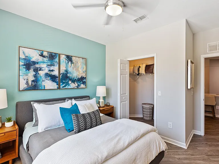 Furnished bedroom with walk-in closet at The Savoy at Southwood