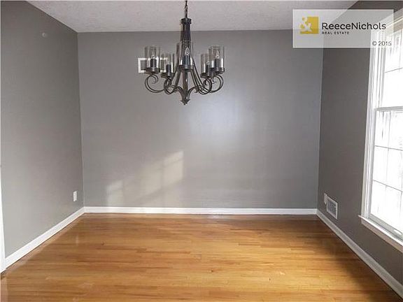 Formal Dining area off Kitchen with refinished Hardwood Floors, new Light Fixture and Large Window for great natural lighting.