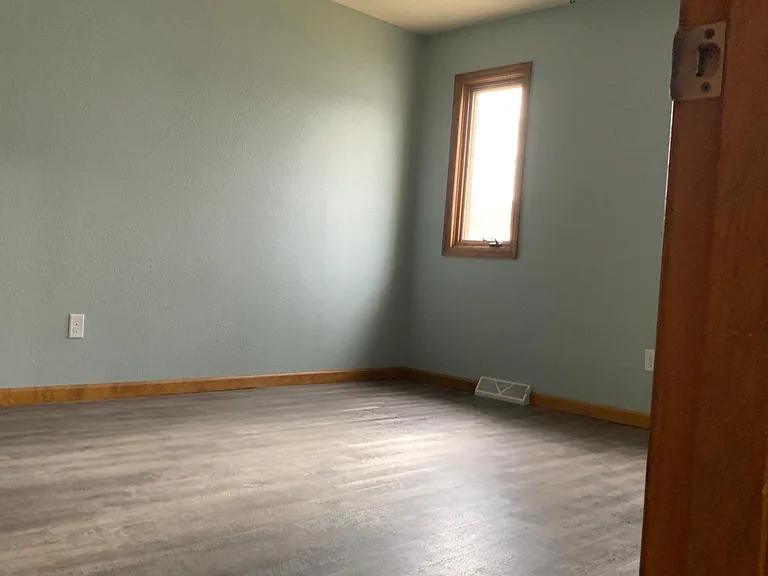 Master bedroom is larger and features multiple windows