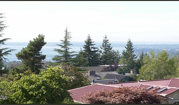 View of parts of Bellingham and the bay. This is a hazy day so you cannot see the Canadian mountains or lights of Vancouver at this time.