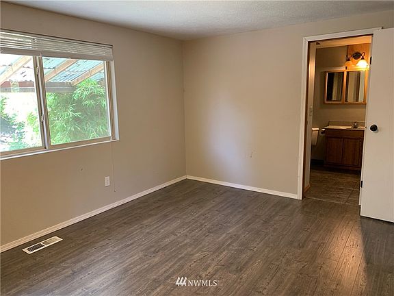 Master bedroom has newer laminate flooring