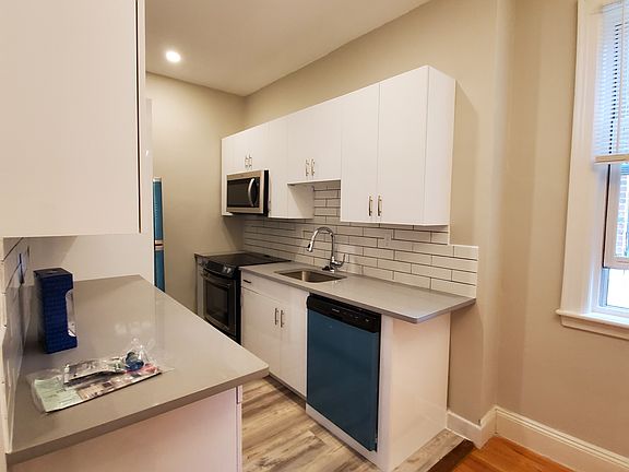 Quartz kitchen counters, new cabinets and stainless steel dishwasher, french door refrigerator, stove and microwave.