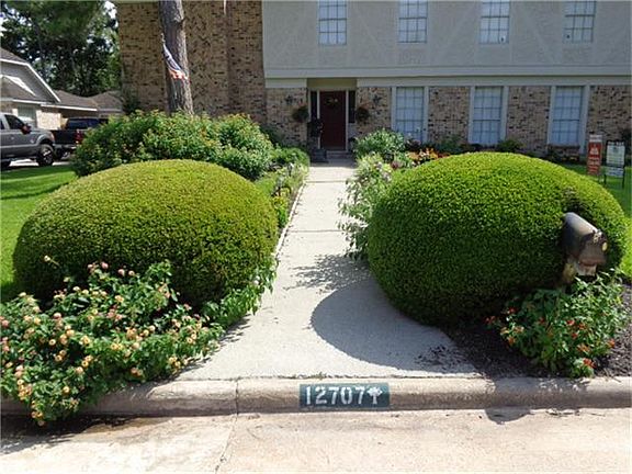 Beautifully landscaped front walkway.