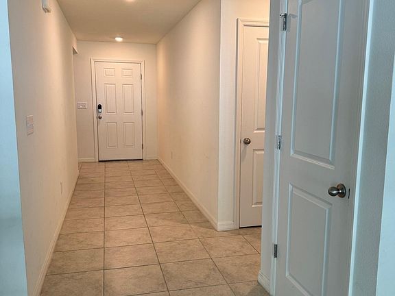 Pantry, coat closet and tiled floors