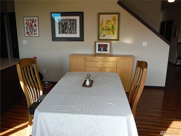 Dining area next to kitchen with views out the slider to back yard