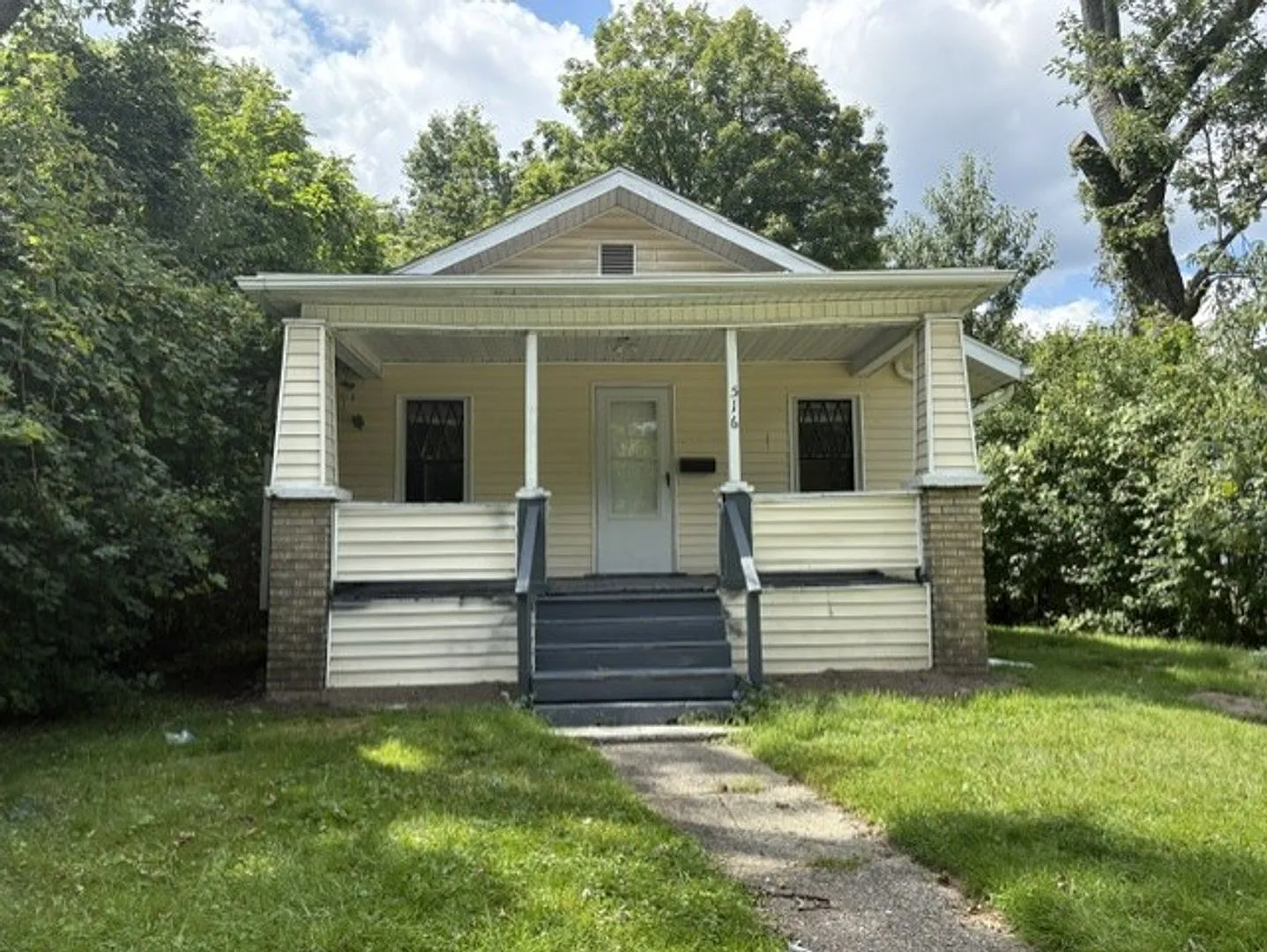 Charming 3-Bedroom Akron Home with a Covered Porch and Private Yard — Photo 1