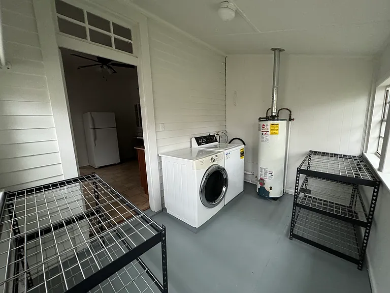 Utility Room with full-size washer and dryer, and storage
