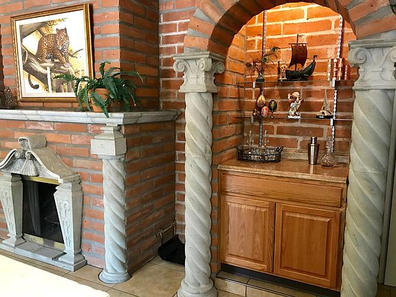 Detail of Wood Burning Fireplace & Niche that is Nice to Customize in Addition to the Built In Cabinetry Providing Additional Storage