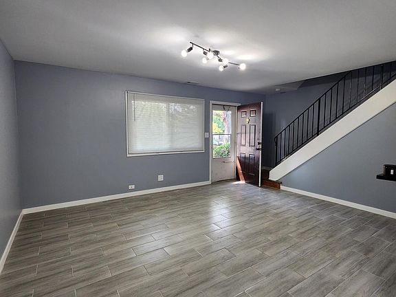 Front entrance opens up to the spacious living room and staircase to the second floor.