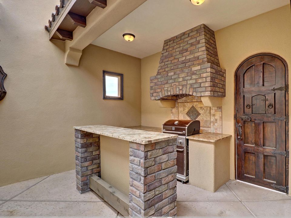 Covered Bar amp Grille Kitchen featuring optional brick accents and old world timber doors
