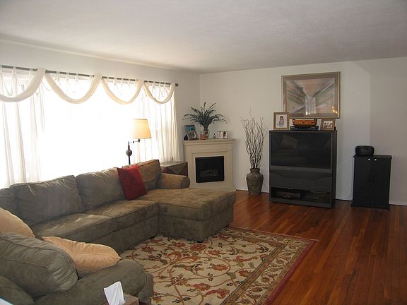 Living Room with huge picture window and BTU Vent Free fireplace