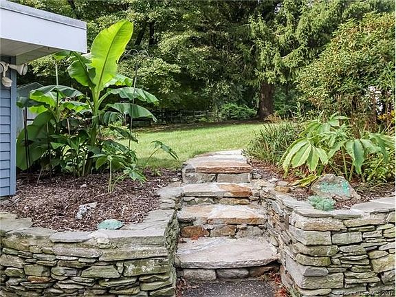 Natural stone wall, steps a...