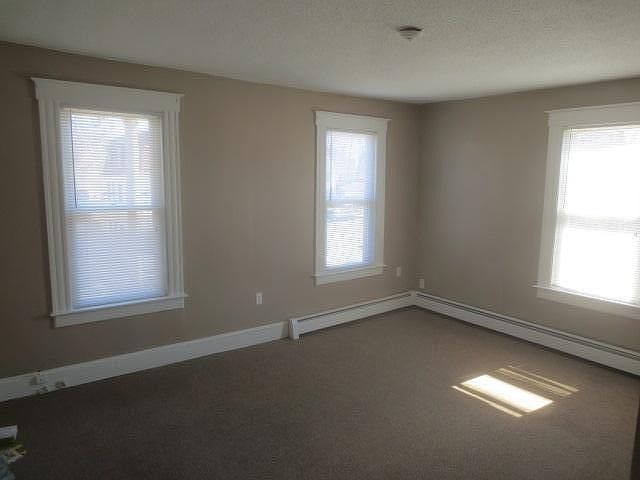 Large living room or bedroom. Front of building.