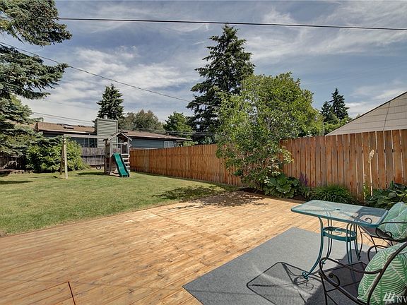 Peaceful fully fenced rear yard, nice deck to enjoy shady summer afternoons and let the kids and pets play