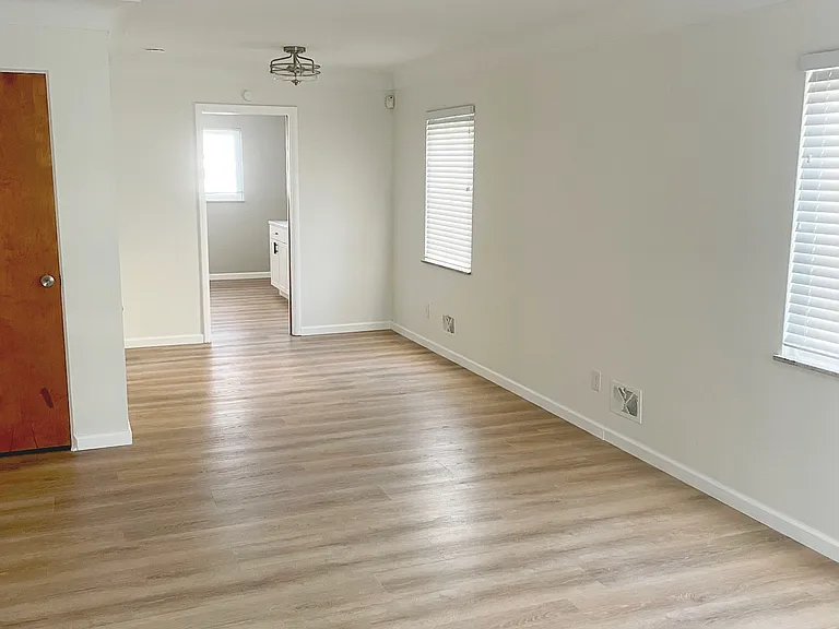 New flooring and light fixtures in living area
