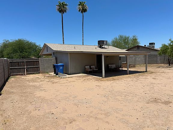 Large, fenced backyard with RV Gate.