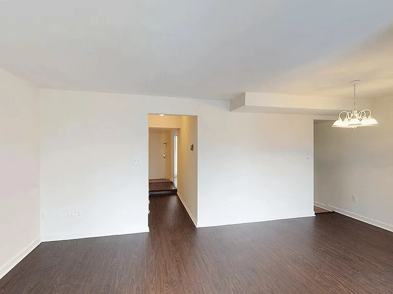 Spacious living space with vinyl flooring