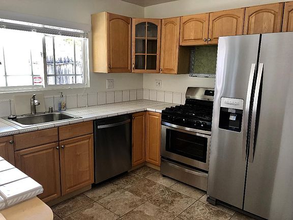Natural gas cooking, venting microwave to be added over stove, extra spacious side by side refrigerator/freezer