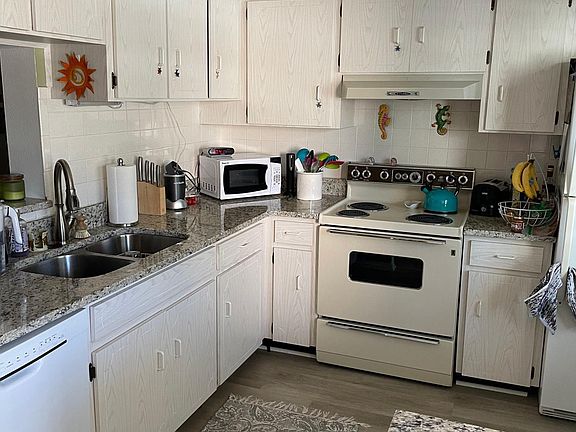 Kitchen with new granite counter and vinyl floor
