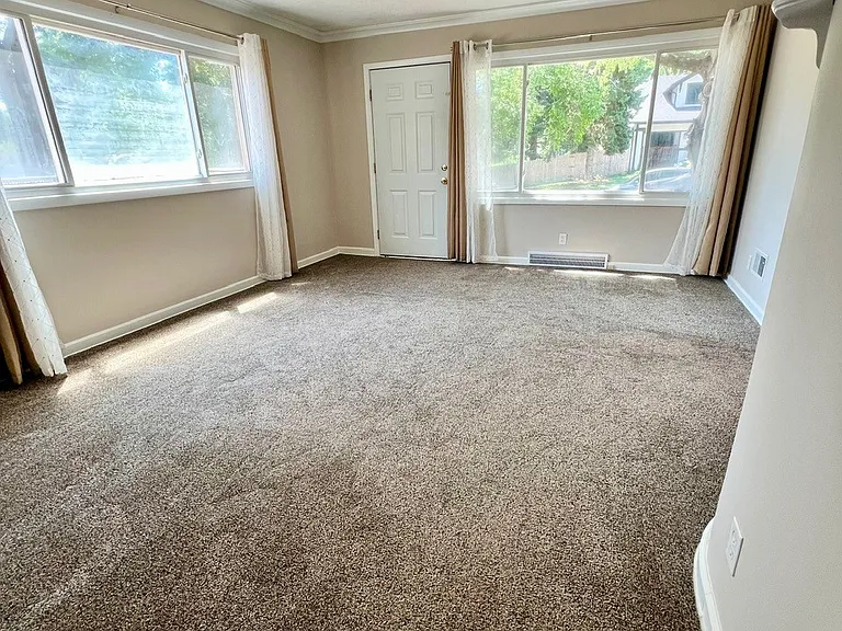 Large living room features 2 large windows for lots of natural light.