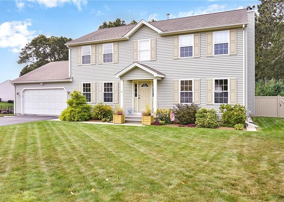 Beautiful landscaped front yard with underground sprinklers.