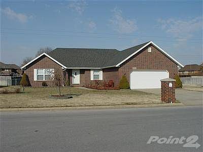All brick exterior with mature landscaping. 18x13.5 screened/covered patio. The garage is oversized 