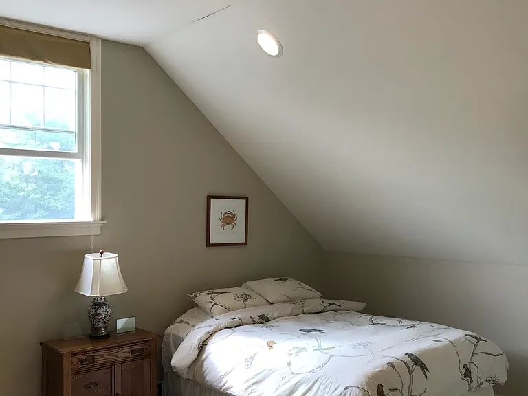 Third floor bedroom (wood floors installed since photo).