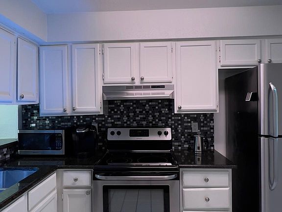 View from hallway towards kitchen and the self cleaning range.