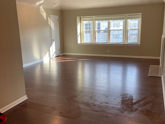 Living room, dining room, coffered ceiling, fireplace, closet