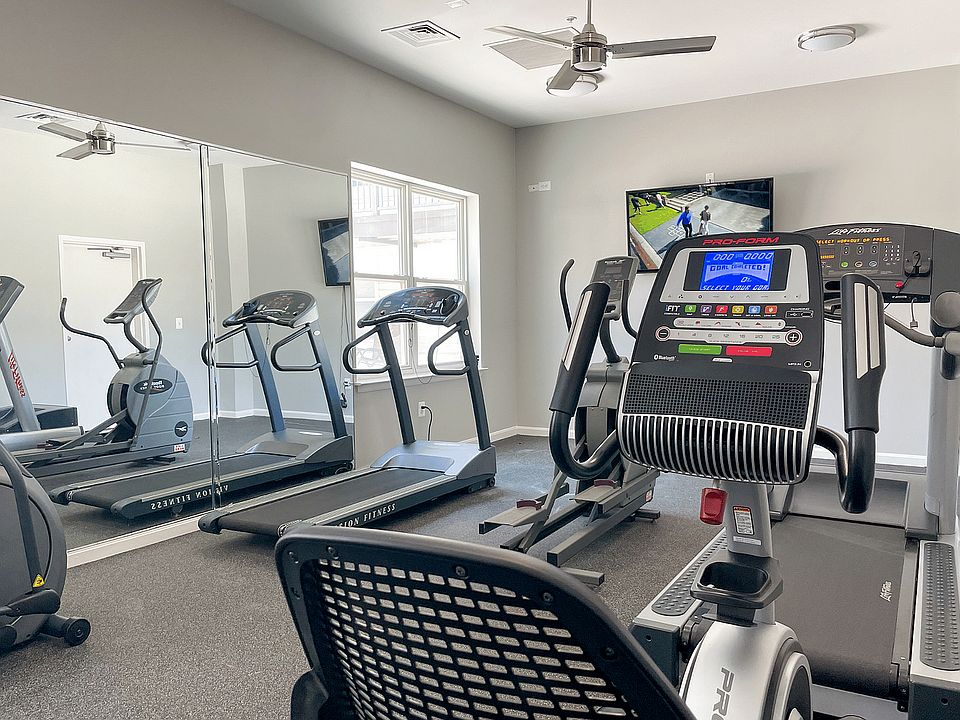 Elevate your fitness journey in this well-equipped and inviting workout space.