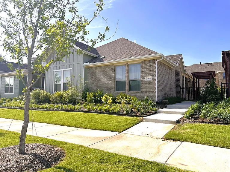 Beautifully maintained corner unit with curb appeal
