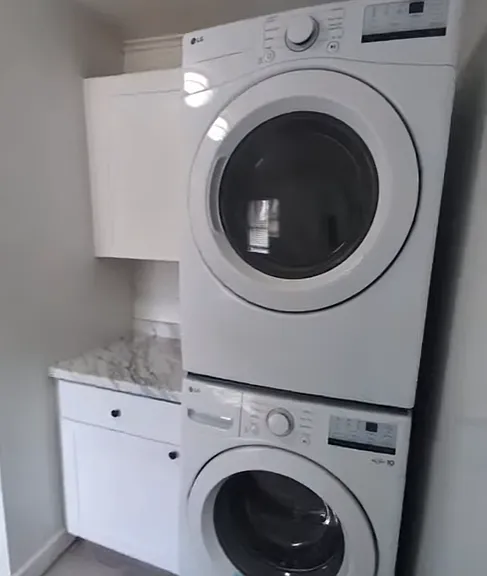 Laundry area inside bathroom.