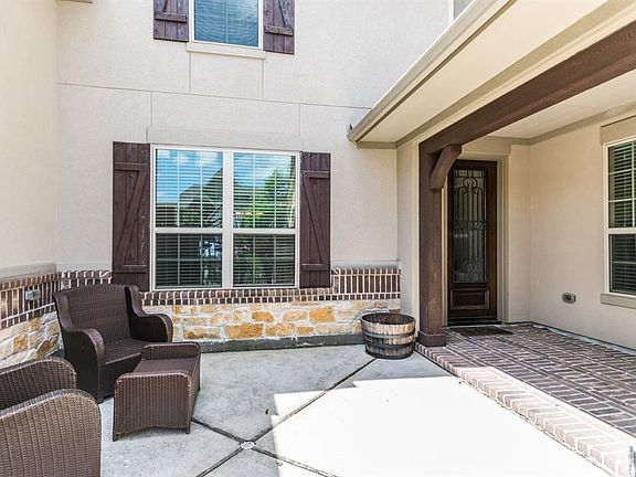 You are greeted by this welcoming court yard as you enter the property.