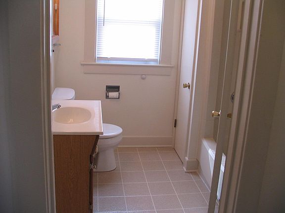 linen closet and tub with shower