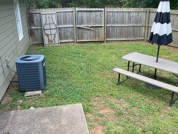 Private, not shared, fenced-in backyard (bench not included)