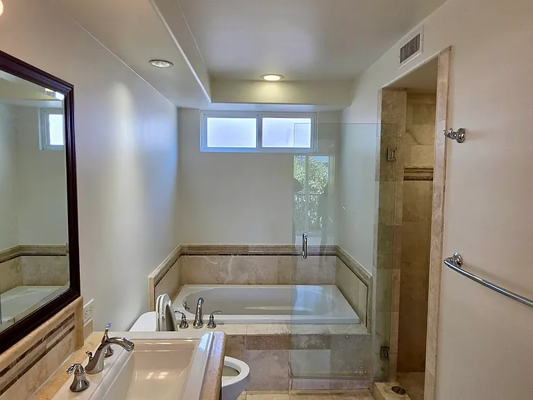 Master bathroom with tub and walk in shower